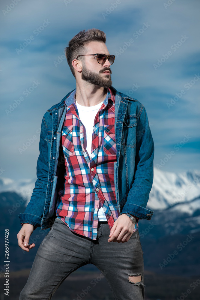 Wall mural portrait of a young bearded man looking to side