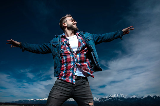 happy young casual man in a fly pose is dreaming