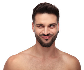 Obraz premium funny topless guy with beard looking away