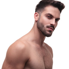 Naklejka premium side view of a undressed man with beard looking charming