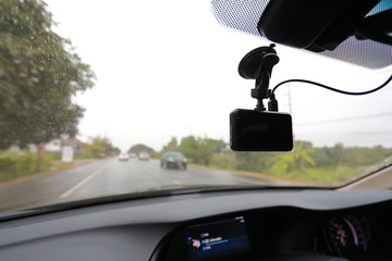 video camera recorder inside car driving rainy day