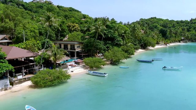 Flight along the beautiful beachfront of Chalok Baan Kao Bay on the paradisiacal island of Koh tao, Thailand