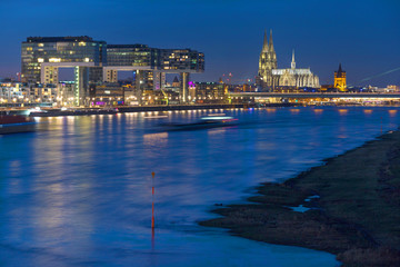 dom of cologne and the rhine river front at night in germany