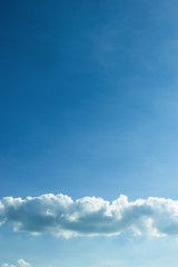 fluffy cloud above clear blue sky