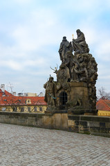 Fototapeta na wymiar Sculptural compositions of Charles Bridge, Prague, Czech Republic. Sculptural group of Saints John de Mata, Felix de Valois and John Bohemian, or Prague Turk