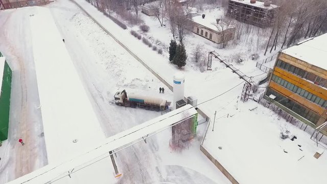 bird eye view truck tank filled with gas products under snow