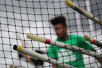athletes participate in the pole vault