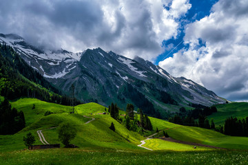 Mountain range clouds panoramic landscape. Green mountain range view. Mountain peak blue sky white clouds panorama.