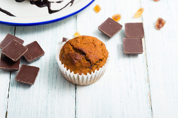 chocolate cupcakes, old white wooden table