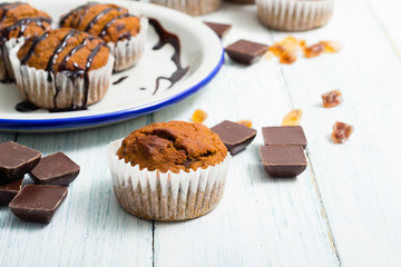 chocolate cupcakes, old white wooden table