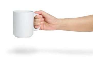 Hand holding a ceramic mug isolated on white with clipping path