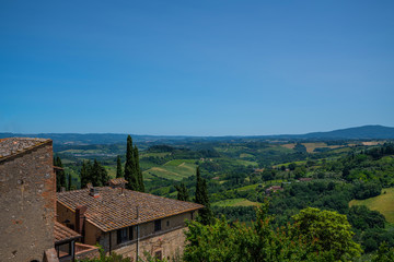 Fototapeta na wymiar In the very heart of Tuscany. View from the fortress wall to the beautiful valley of the medieval town of Montepulciano, Italy.