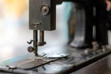 sewing machine,old sewing machine,vintage style,soft focus.