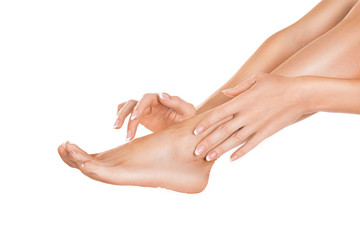 Close up view of a female leg and hands. Skin care concept