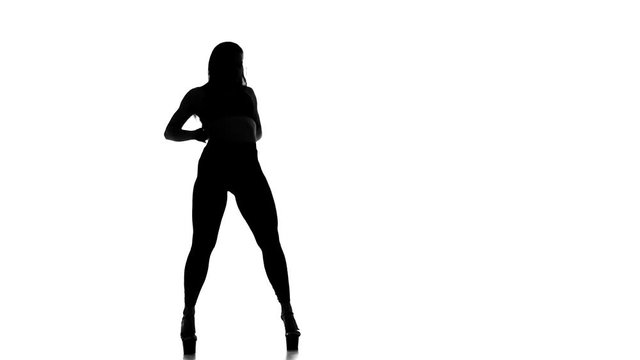 black silhouette on white background girl dancing modern dance, strip plastic