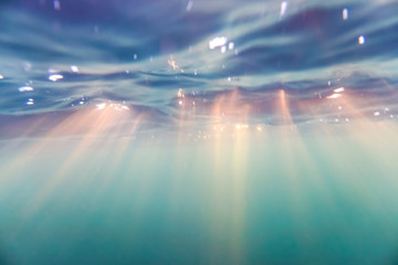 Bright beams of sunlight refracting through the surface of the atlantic ocean. © Snorre