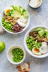 Vegetarian lunch bowl with marinated egg and edamame beans