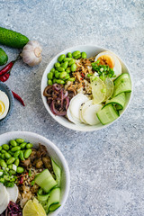 Vegetarian lunch bowl with marinated egg and edamame beans