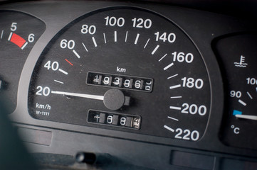 A speedometer of a car. Max speed 220 km/h.