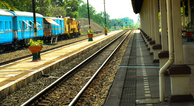 Railway tracks used by the train station as the background.
