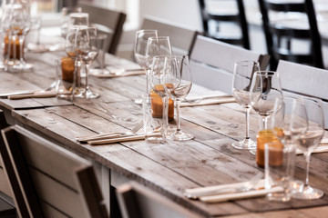 table set on dining table with wooden chairs.