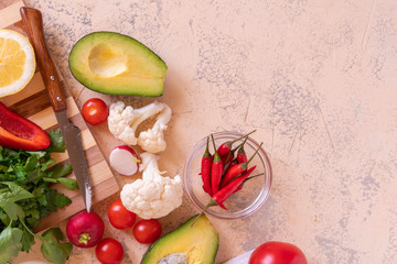 fresh sliced ingredients for detox sald, cut vegetables and fruits on the tables