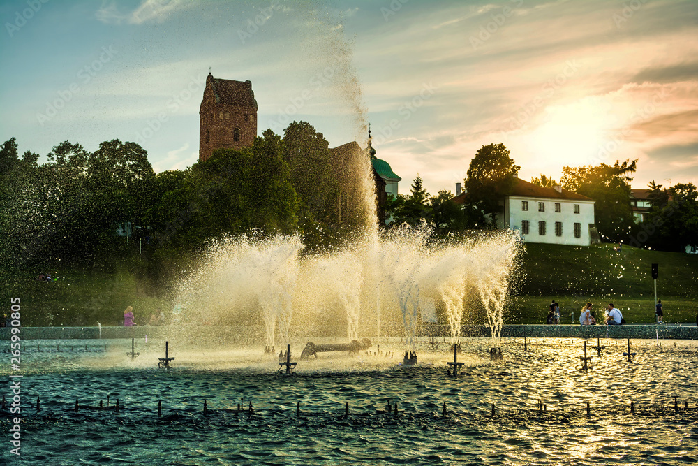 Poster Evening cityscape with Fountain Park in Podzamcze district, Warsaw city, Poland