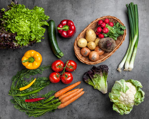 Fresh organic vegetables on rustic background