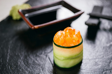 Spicy salmon topped sushi roll with philadelphia cream cheese, restaurant serving. Delicious...
