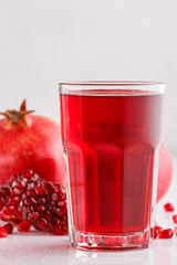 grains of a grenade on a white acrylic background