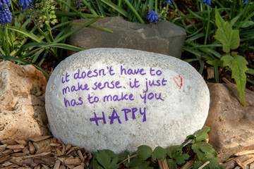 Stone with text: It doesn’t have tot make sense, it just has to make you happy