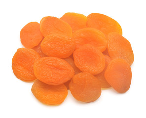 Heap of dried apricots fruit isolated on white background. Top view, flat lay