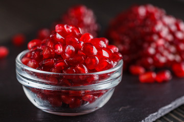 grains of a grenade on a dark rustic background