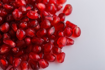 grains of a grenade on a white acrylic background