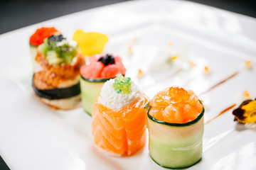 Plate with five different sushi rolls. Degustation, gastronomy, seafood Japanese food art, restaurant menu concept, deluxe chef cuisine