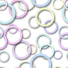 Abstract seamless pattern of randomly arranged colored rings with soft shadows on white background