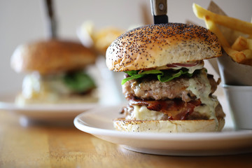 Delicious pork burger with bacon serving in restaurant