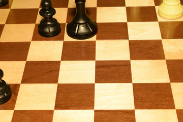 Wooden chess board and white pawns as a skill concept