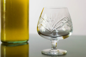 Empty cognac glasses on a table.