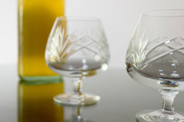 Empty cognac glasses on a table.