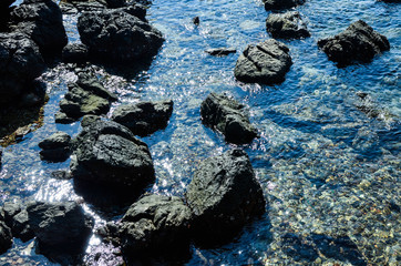 stones in the sea waves water coast