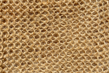 The texture of the knitted fabric from the threads of natural wool fibers.