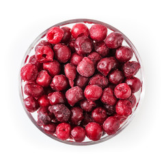 Frozen cherries in glass bowl isolated on white background with clipping path