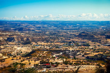 Beauty landscape with hills, mountains, trees and blue sky.