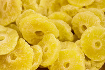 dry canned pineapple circles supermarket tropic fruits selling counter background from above 