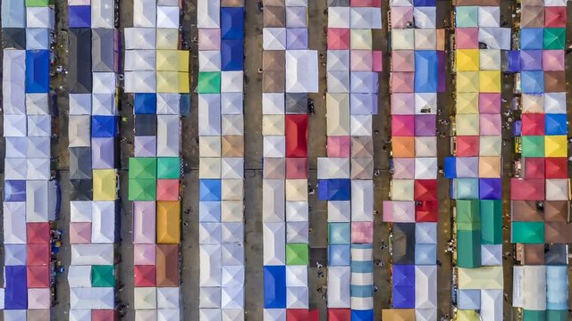 aerial top view train night market ratchada multi color beautiful abstract art time lapse view in bangkok, bangkok market, thailand.