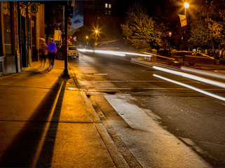 Deep shadows and light flares on dark streets