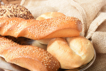 various fresh crispy baked buns with seeds