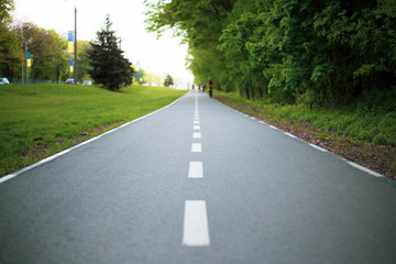road in the park lines start finish bicycle road stripes  life green road