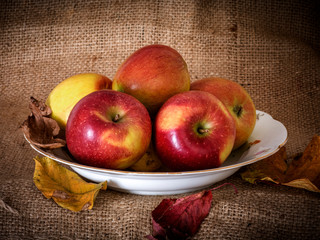 Apples on fruit plate with background